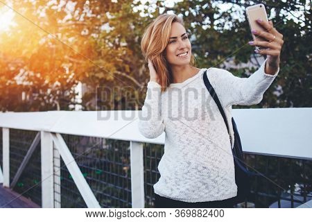 Beautiful Woman Searching Inform Ation Via Cell Telephone During Walking Outdoors