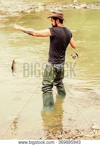 Always Hooked Up Fishing. Summer Weekend. Big Game Fishing. Mature Man Fly Fishing. Man Catching Fis