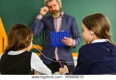 Instead Studying. School Students And Teacher. Addicted To Internet Online Games. Compliance With Sc