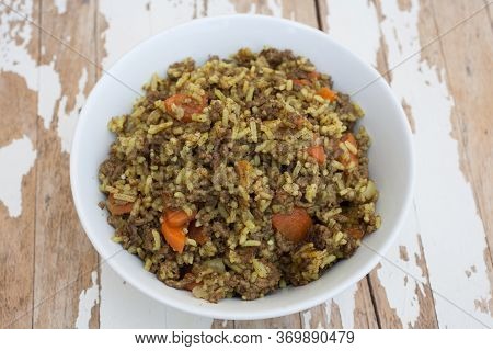 An Iraqi Carrot Rice Dish Served With Minced Beef