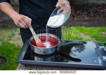 Chef Cooks Berry Puree For Making Marmalade. The Process Of Making Berry Jam.