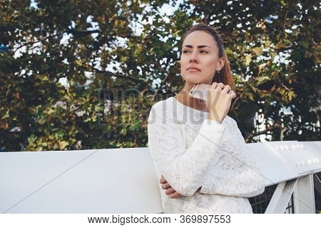 Beautiful Woman Searching Inform Ation Via Cell Telephone During Walking Outdoors