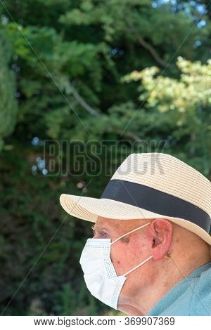 Elderly Man Wearing Face Mask As Coronavirus Protection,hampshire,united Kingdom.