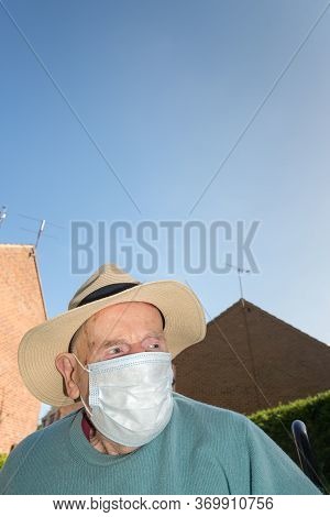 Elderly Man Wearing Face Mask As Coronavirus Protection,hampshire,united Kingdom.