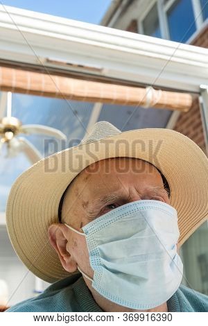 Elderly Man Wearing Face Mask As Coronavirus Protection,hampshire,united Kingdom.