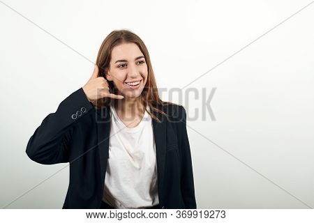 Imitates Telephone Conversation, Keeps Hand Near Ear As If Holding Mobile Phone. Talking On Smartpho