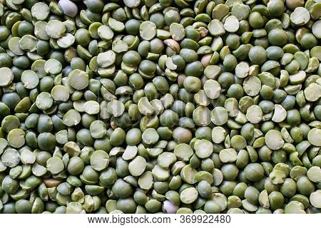 Unsorted Green Split Peas Background Showing Some Broken, Dried  And Damaged Peas That Need To Be We