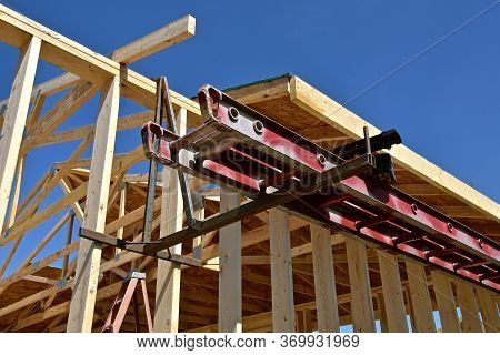Colorful Painted Scaffolding Is Being Used At A Construction Site Of A Garage Under Progress