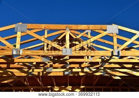Pre-built Trusses And Rafters Are In Place On A New Constructed Garage.
