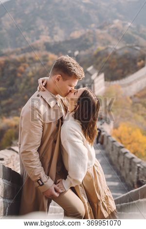Beautiful Young Couple Showing Affection On The Great Wall Of China