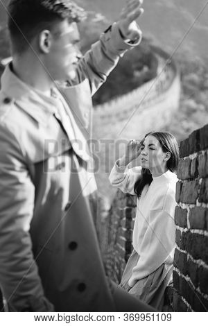 Beautiful Young Couple Posing At The Great Wall Of China