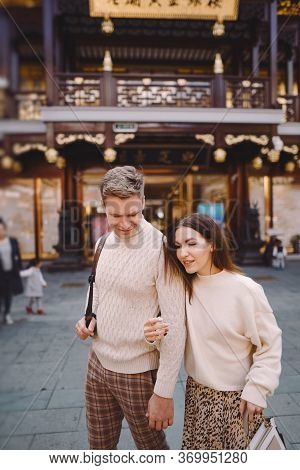 Newlywed Couple Showing Affection And Holding Hands In Shanghai Near Yuyuan While Visiting China