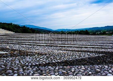 Cobbled Square Surrounded By Nature In Possagno, Treviso, Italy