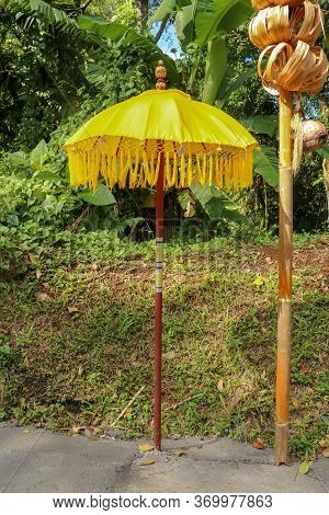 Decoration Of Hindu Temple Complex Batukaru On Bali Island In Indonesia. Yellow And White Decorative