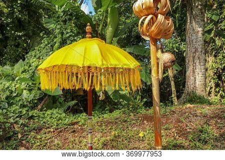 Decoration Of Hindu Temple Complex Batukaru On Bali Island In Indonesia. Yellow And White Decorative