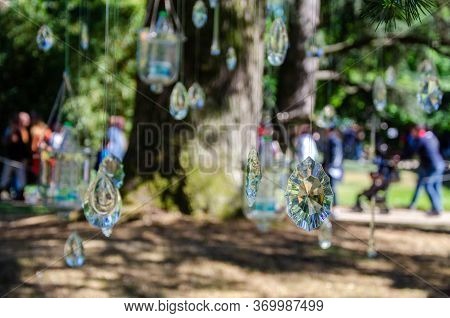 Hanging Crystal Decorations In A Park With Blurred Background