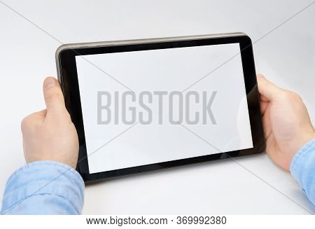 Male Hands Holding Digital Tablet Blank Screen On White Background. Take Your Screen To Put On Adver