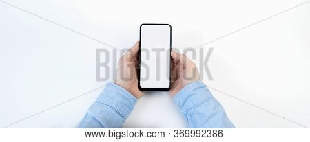 Male Hands Holding Smartphone With Blank Screen On White Background