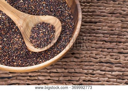 Black Quinoa Seeds - Chenopodium Petiolare. Wood Background