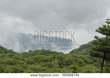 View Through The Clouds Of A Bay On Lantau Island, Hong Kong