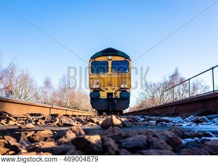 A Point Of View Image Of The Front Of A Freight Locomotive Moving Towards A Person On The Railway Li