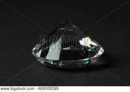 Beautiful Dazzling Diamond On Dark Background, Closeup. Precious Gemstone