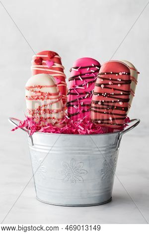 A Tin Pail Filled With Homemade Valentines Day Cakesicles.