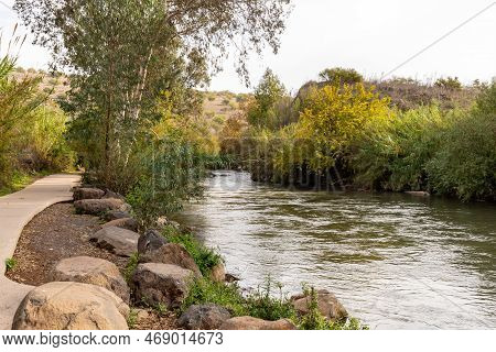 The Jordan River Flows Near The Ruins Of The Fortress Wall Of The Ateret Fortress - Metzad Ateret - 