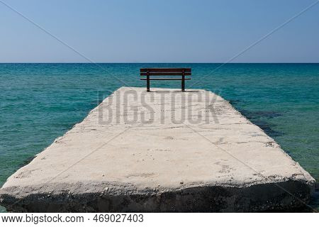 Stone Pier With Blue Sea And Sky Background. Copyspace