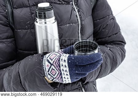 Man Drinking Tea From A Thermos In Winter. Man Drinking Tea Outdoors. Thermos With Hot Drink