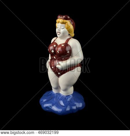 Figurine Of An Elephant On A Black Background With Reflection. Antique Porcelain Figurine Of An Elep