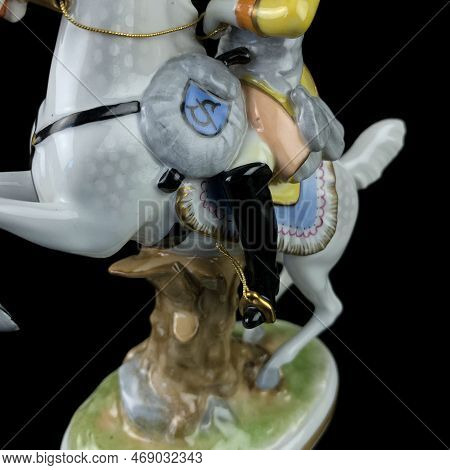 Figurine Of An Elephant On A Black Background With Reflection. Antique Porcelain Figurine Of An Elep