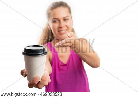Fit Adult Woman Smiling Wearing Pink Gym Tanktop For Workout Presenting Close-up Of Paper Coffee Cup