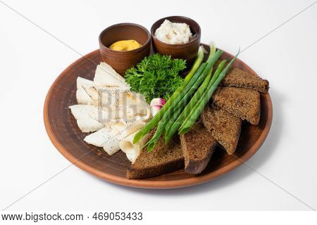 A Delicious Dish Of Sliced Lard With Bread And Spices