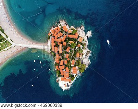 Aerophotography. Aerial View Of Sveti Stefan Island In A Beautiful Summer Day, Montenegro From Flyin
