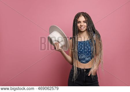 Beautiful Woman With Long African Braids And Hat On Pink Background, Space For Text