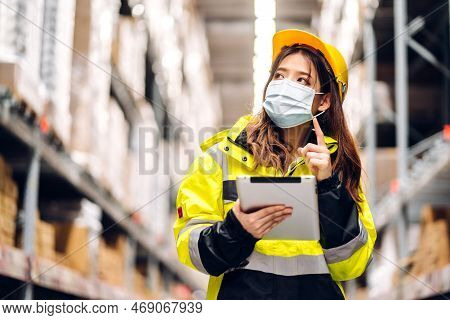 Portrait Asian Engineer Woman Shipping Order Detail On Tablet Check Goods And Supplies On Shelves Wi