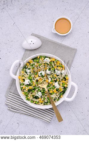 Salad Of Vegetables, Pasta And Mozzarella In A Dish On A Light Background. Top View.