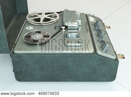 A Vintage Reel-to-reel Analogue Analogue Audio Recorder In A Leather Case On A White Studio Backgrou