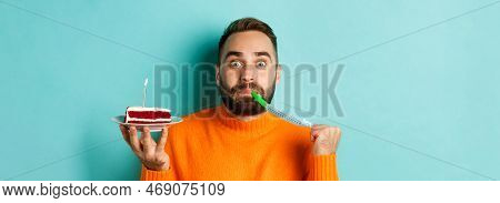 Close-up Of Funny Adult Man Celebrating His Birthday, Holding Bday Cake With Candle, Blowing Party W
