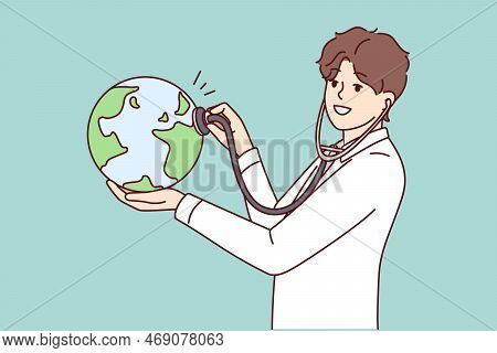 Man Doctor Applies Stethoscope To Globe Demonstrating Care For Ecology And Nature. Eco-activist Guy 