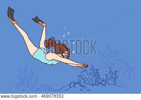 Woman Diver Swims Underwater Enjoying Beauty Of Ocean Floor Covered With Algae. Girl In Oxygen Mask 