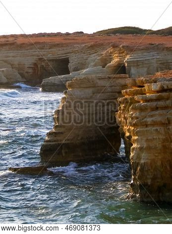 Water Caves And Rock Formations Close To Coral Bay On Cyprus Island.