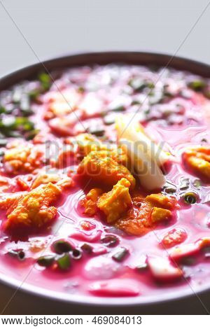 Cold Beetroot Soup With Boiled Eggs And Greenery. Traditional Summer Food.