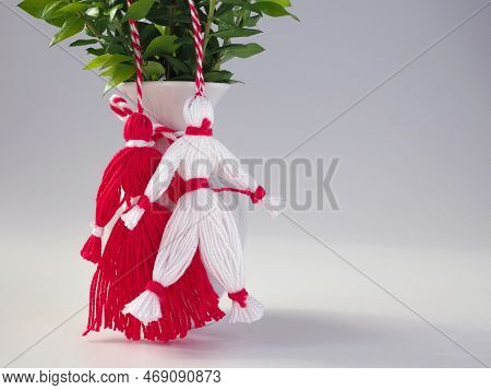 Martisor Red And White Dolls On A White Background. Holiday Martisoare And Baba Marta.