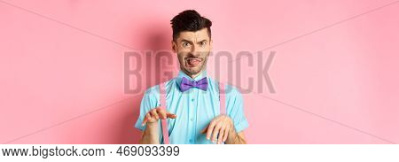 Funny Guy Looking At Something Disgusting With Aversion And Cringe, Show Tongue And Shaking Hands In