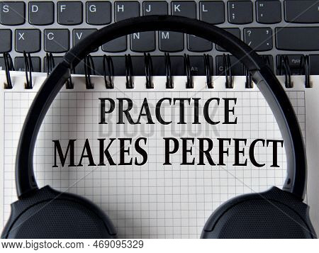 Practice Makes Perfect - Words On White Notepad With Keyboard And Headphone Background
