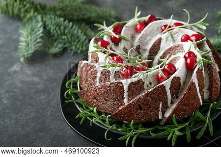 Christmas Chocolate Bundt Cake. Traditional Christmas Fruit Cake With White Glaze, Cranberries And R