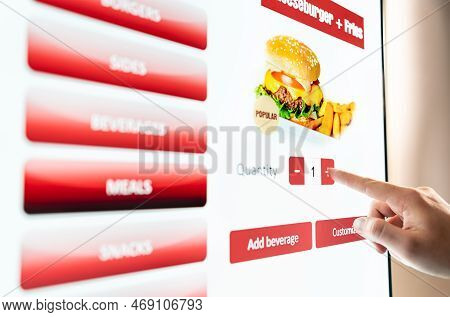 Self Service Order Kiosk And Digital Menu In Fast Food Burger Restaurant. Touch Screen In Vending Ma