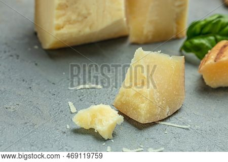 Traditional Gravyer Gruyere Cheese Hard Yellow Cheese Without Holes, With A Dark Crust And A Pleasan